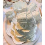 A Shelley style scalloped and ribbed white glaze 21 piece tea service