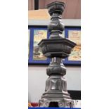 A Chinese pewter lamp with geomatic and stepped decoration