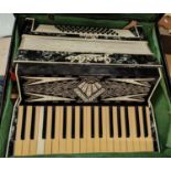 A 48-base accordion by Geraldo, cased