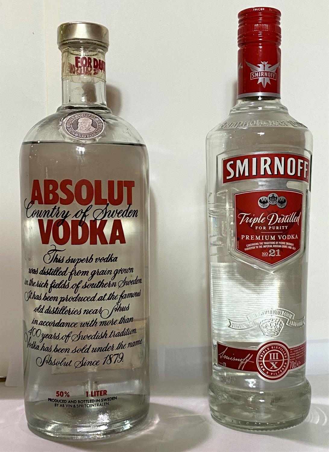 A litre bottle of Absolut vodka, 50% vol; a 70cl bottle of Smirnoff vodka 37.5% vol