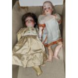 Two 19th century continental porcelain head dolls with jointed bodies, 25cm