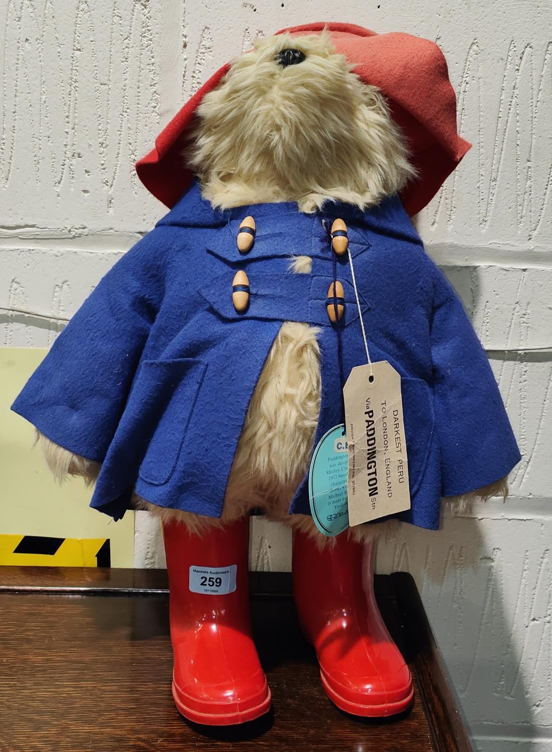 A Gabrielle designs Paddington Bear with red hat and boots and a blue coat, ht. 48cm