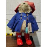 A Gabrielle designs Paddington Bear with red hat and boots and a blue coat, ht. 48cm