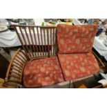 A modern Ercol light wood settee lathe back and matching foot stool, approx. 195 x 96cm