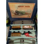 A Hornby train boxed tin plate clockwork 'O' gauge set loco carriages etc, track, signals and