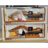 Two boxed Komatsu Tomica Dandy 1/43 scale DK-001 PC200 diecast digger (one plastic front missing)