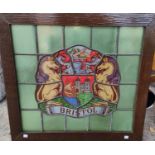An oak framed stained leaded glass crest of Bristol 49 x 53cm
