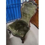 A Victorian mahogany chair with carved crest on knurled legs (requires reupholstery)