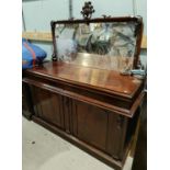 A mahogany mirror back sideboard with two arch panel doors, fitted double drawers, squared mirror (