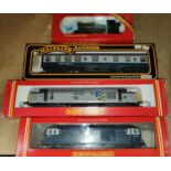 Two Hornby 00-gauge boxed diesel locomotives, a steam locomotive & a mainlines railway carriage.