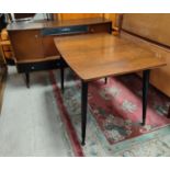A 1950's walnut dining suite with extending dining table with extra leaf, four dining chairs and a