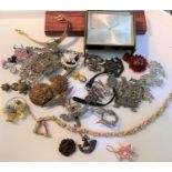 A selection of military badges, buttons, costume jewellery etc