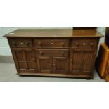 A modern light wood Ercol sideboard height 90cm x width 155 x depth 51cm with fitted cutlery