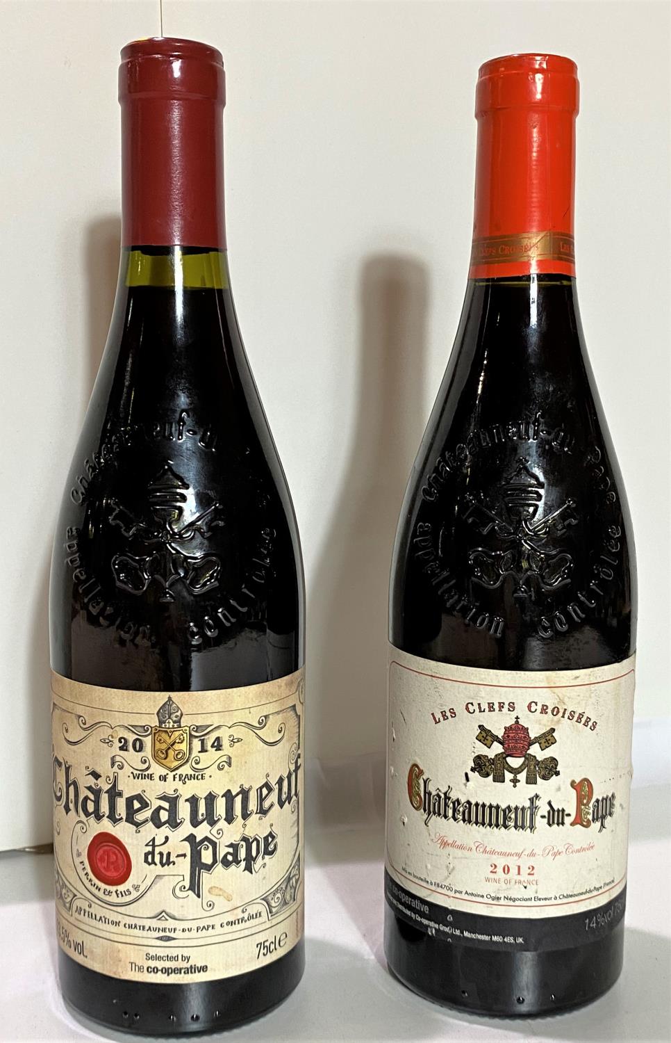 A bottle of Les Clefs Croisees Chateauneuf du Pape 2012, 14% vol and a bottle of The Cooperative