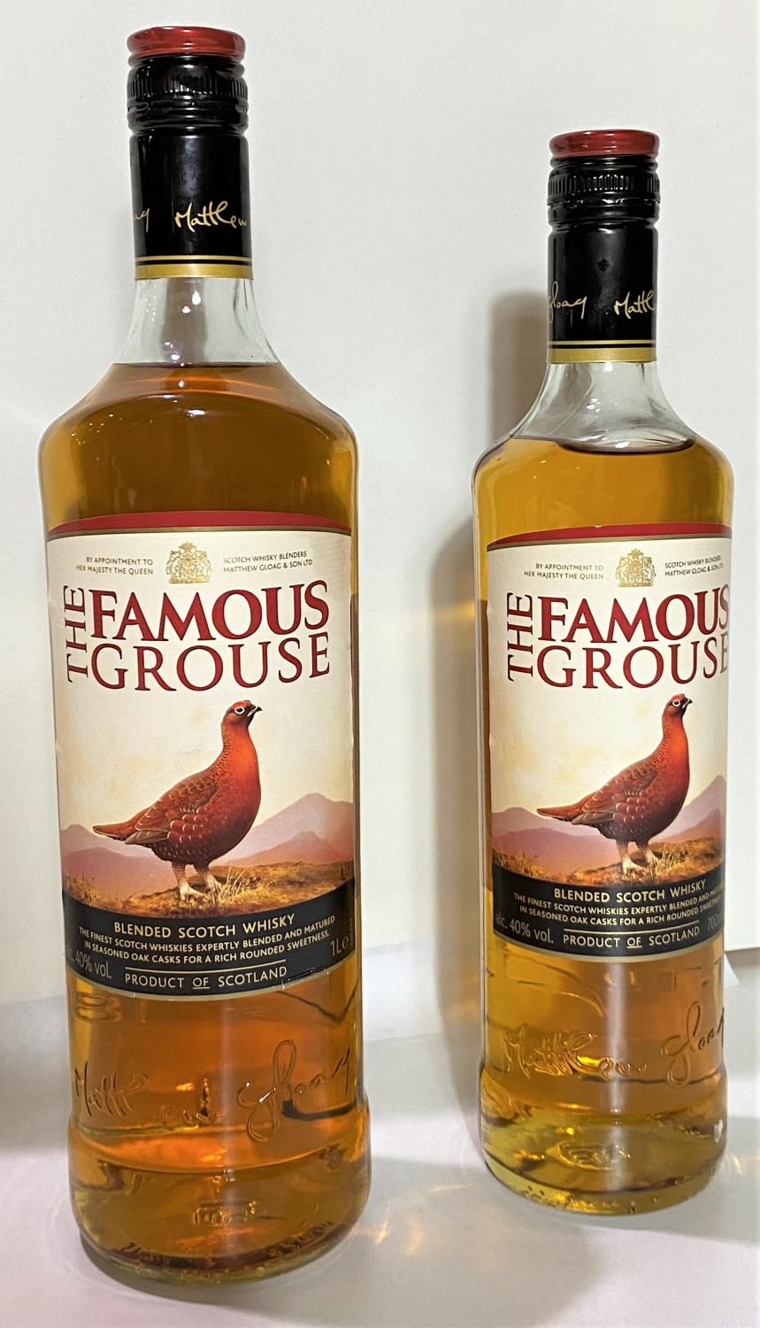 A litre bottle of Famous Grouse whisky 40% vol and a 70cl bottle the same