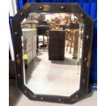 An oak framed 1930's wall mirror with beaded border with canted edges