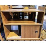 A mid 20th century teak side cabinet with shelf and sliding door, cupboard below