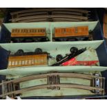 A Hornby train boxed tin plate clockwork 'O' gauge set loco carriages etc, track, signals and