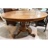 An oval tilt top mahogany supper table with base, 121cm.