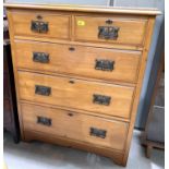An Edwardian satin walnut chest of 3 long and 2 short drawers