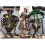 A brass samovar; 2 oil lamp table lights; a plaster figure; 2 other table lamps