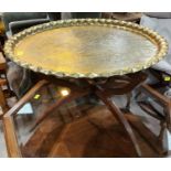 A brass Middle Eastern table with stylish mid century style base