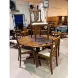 A modern circular pedestal pine dining table and 6 chairs