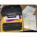 A 1960's portable typewriter; 3 18th/19th century legal documents on vellum