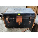 A vintage travel chest with domed studded top and leather binding, by Jekins Bros