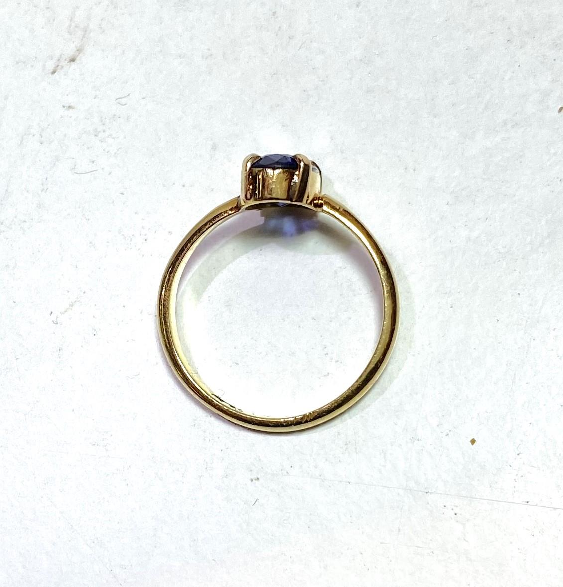 A lady's dress ring with elongated oval sapphire (11 x 6mm approx), in simple 4 claw setting, the - Image 2 of 3