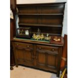 An Ercol modern high back dresser with plate rack over double cupboards, height 161cm, length 120cm
