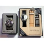 Two originally boxed Kenneth Cole gent's fashion dress watches, one stainless steel with date, one