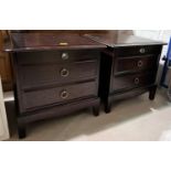 A pair of Stag bedside chest with two draws and pull out above