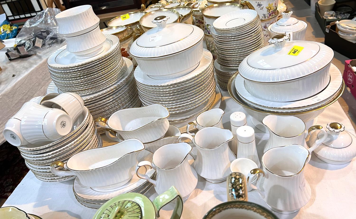 A large part dinner/tea service with gilt rims and fluted borders by Royal Worcester/Hammersley/