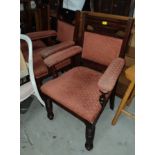 A pair of mahogany armchairs on tuned legs and castors in rust upholstery; 3 oak dining chairs and 3