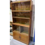 A 1950's oak 5 height stacking bookcase