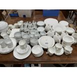 An extensive collection of white glazed dinner and teaware, various factories and designs