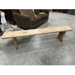 A pine bench with pierced top on shaped supports. 75' long
