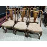 A set of six early 20th century Queen Anne style mahogany dining chairs on cabriole legs