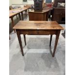 An early 19th century joined fruitwood side table with frieze drawer and shaped apron, on square
