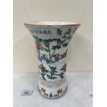 A Chinese famille-verte decorated flared vase, painted with bamboo, birds and prunus 9½' high