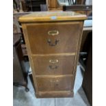 A burrwood veneered filing cabinet of three drawers. 41½' high