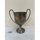 A Victorian silver half-gadrooned two handled cup. Birmingham 1900. 7' high. 8ozs 14dwts