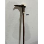 A hazel walking stick, the antler handle with integral whistle and carved with a fish
