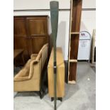 A decorative green painted wood oar. 72½' long