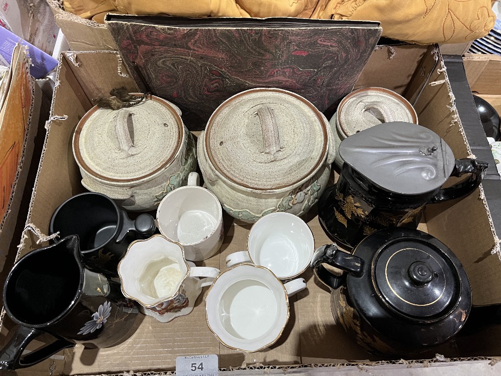 A box of ceramics with an early 20th century photograph album