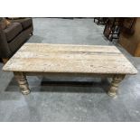 A joined pine low table on turned legs. 48' long