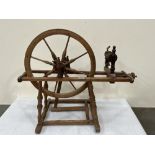 A French pine spinning wheel. 32' long. (Worm holes but not active)