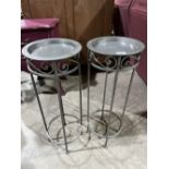 A pair of metal plant stands. 28' high