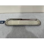 An Edward VII silver dressing table tray with gadrooned rim. Sheffield 1909. 8¼' long. 1oz 8dwts